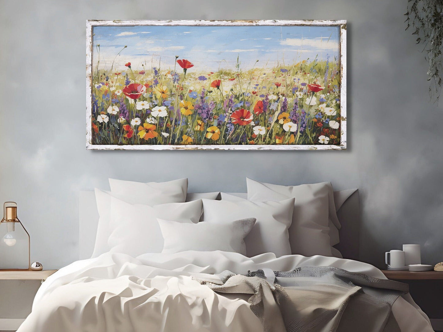 canvas wall art featuring a field of vibrant wildflowers and a faux wooden frame