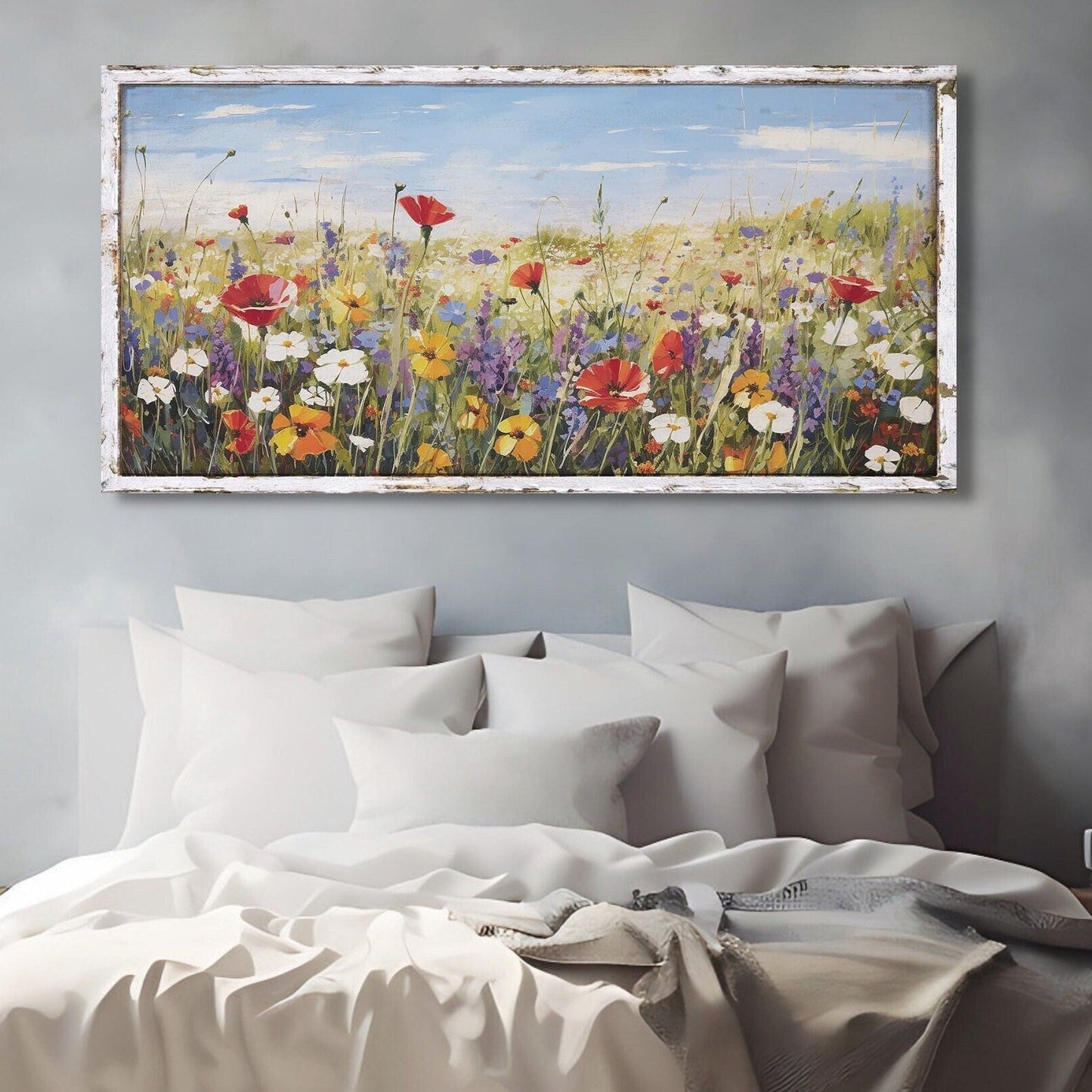 canvas wall art featuring a field of vibrant wildflowers and a faux wooden frame