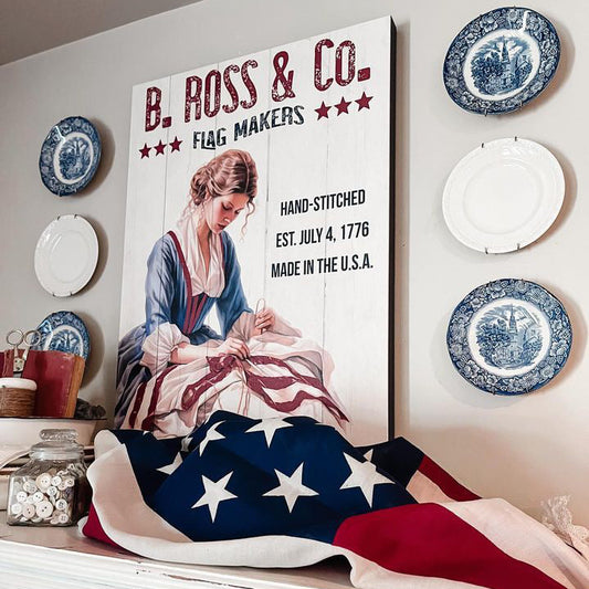 Decorative wall with American flag, 'B. Ross & Co.' sign, and plates on a white wall.