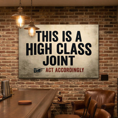 A rustic home bar interior with a wooden bar counter, bar stools, brick wall, shelves of bottles, and a large wall sign that reads 'THIS IS A HIGH CLASS JOINT' with a small 'Act Accordingly' logo.