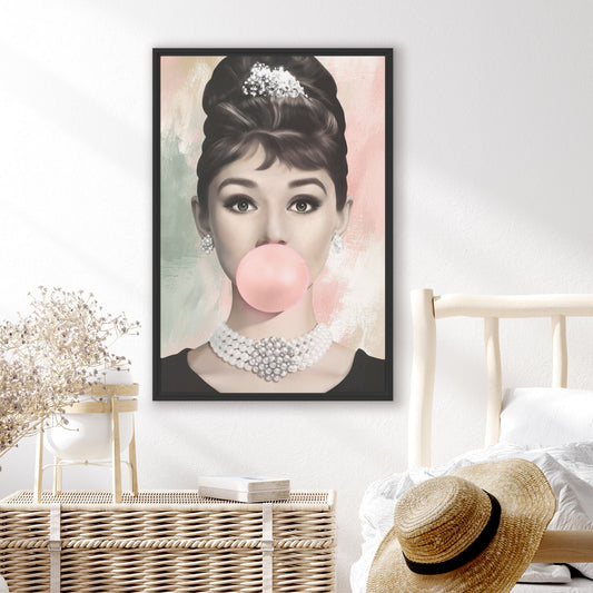 Framed abstract pop culture artwork of Audrey Hepburn with a pink bubble gum in a bedroom setting.
