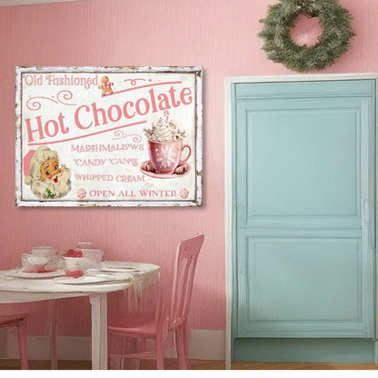 pink and white canvas sign that says Old Fashioned Hot Chocolate. Features a pink retro santa, a gingerbread man and a cup of hot chocolate