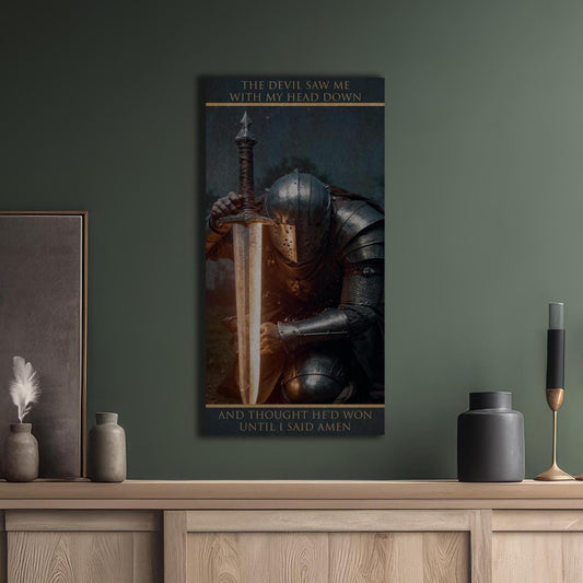 May include: A digital art print featuring a knight kneeling with a sword in front of them. The knight is wearing dark armor and has their head bowed. The background is dark and blurry. The text on the print reads: &#39;The devil saw me with my head down and thought he&#39;d won until I said amen.&#39;