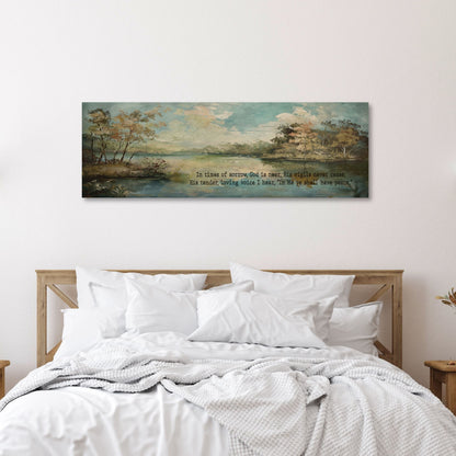 panoramic canvas wall art of a serence landscape with a lake and the words In time of sorrow, God is near, His vigils never cease, His tender loving voice I hear, In Me ye shall have peace.