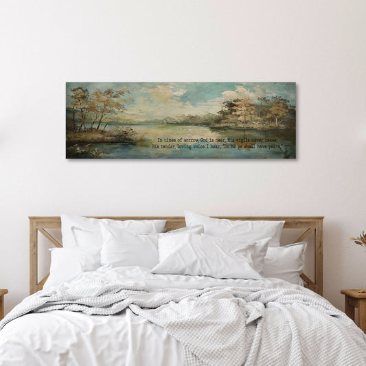 panoramic canvas wall art of a serence landscape with a lake and the words In time of sorrow, God is near, His vigils never cease, His tender loving voice I hear, In Me ye shall have peace.