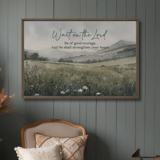 Framed artwork with a landscape scene and Psalm 27 scripture  on a wall above a chair.